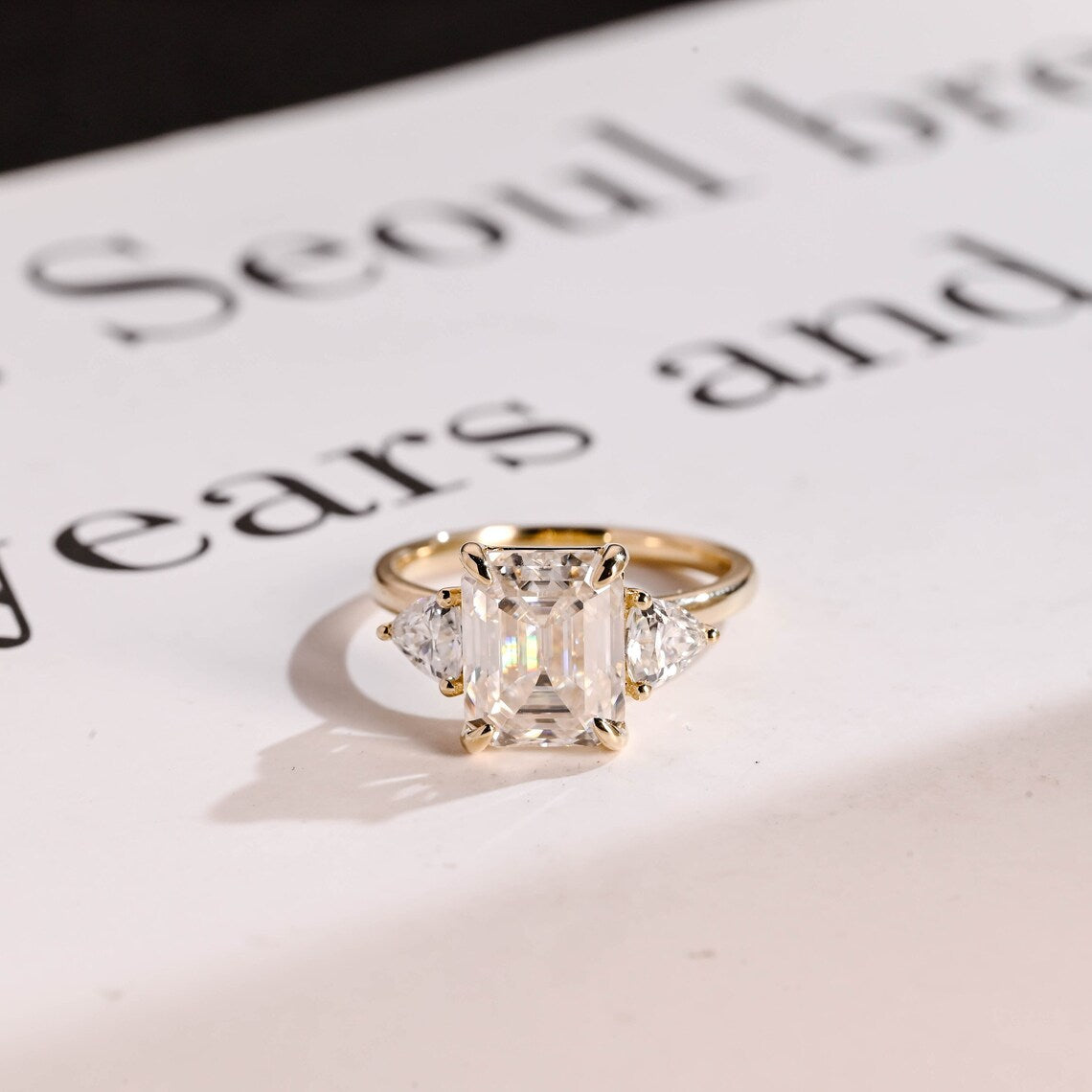 Emerald cut moissanite ring