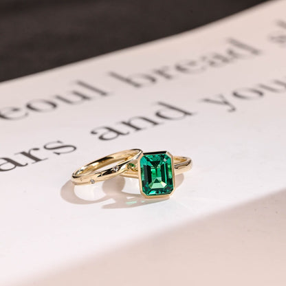 Green bezel emerald moissanite ring
