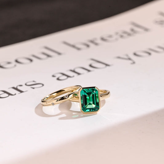 Green bezel emerald moissanite ring
