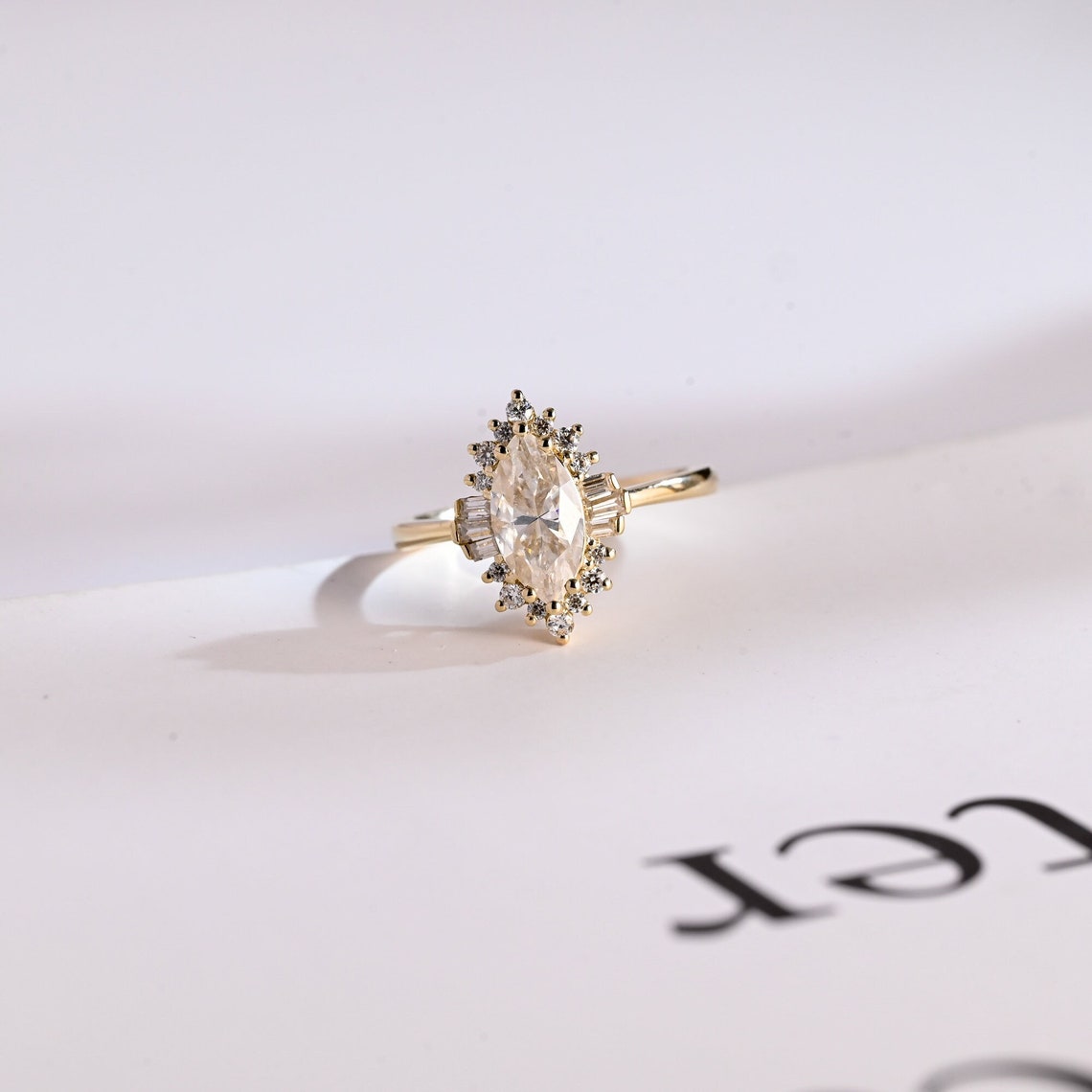 Baguette and round diamond halo ring