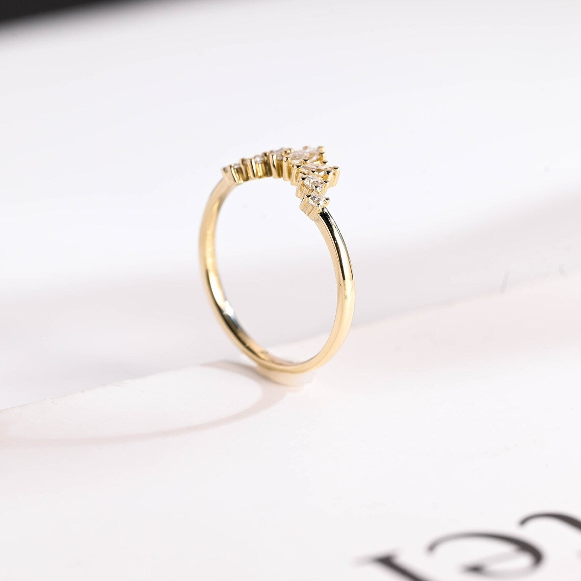 Half eternity curved ring