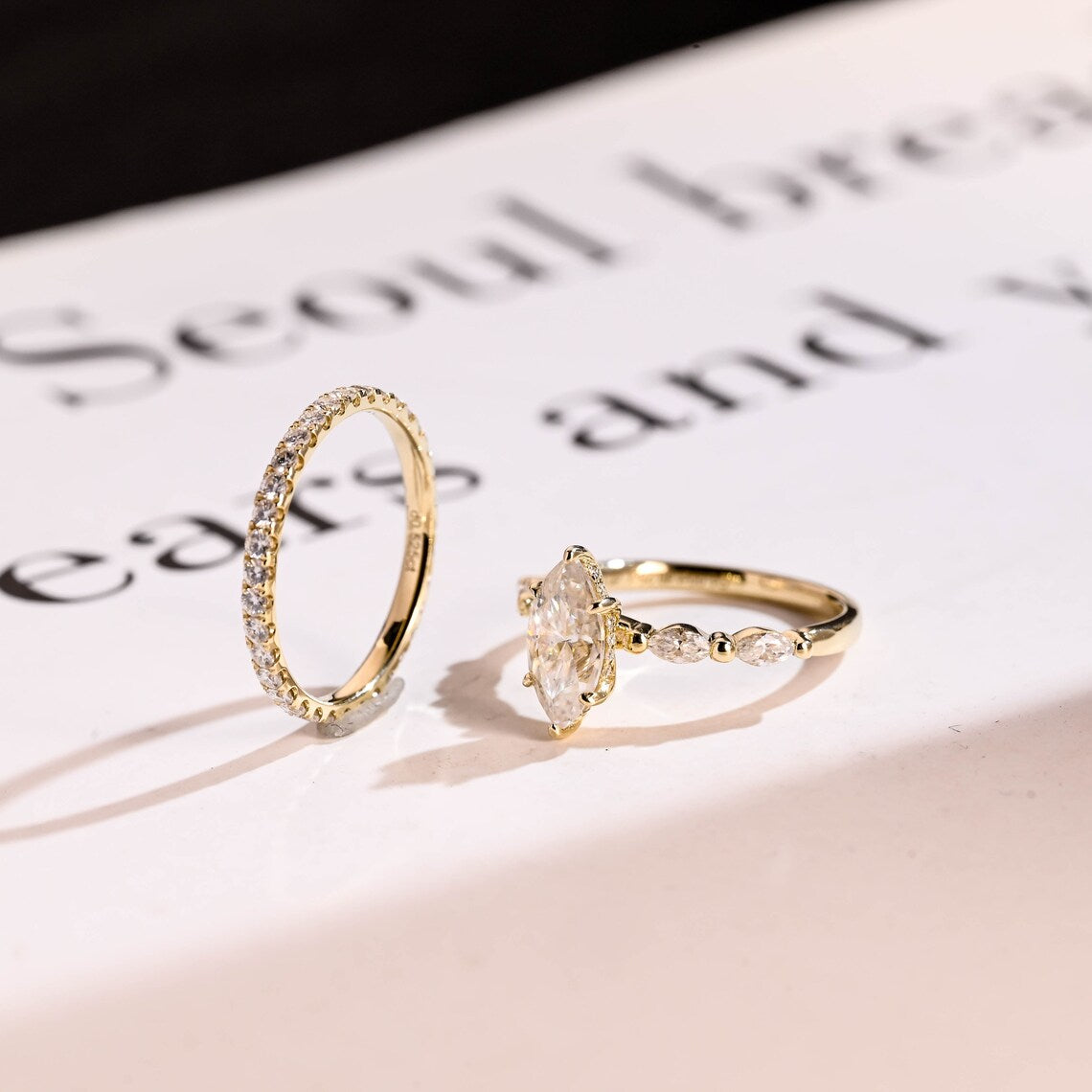 Side stone engagement ring