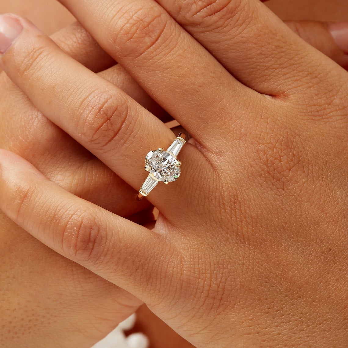 Tapered baguette side stones ring