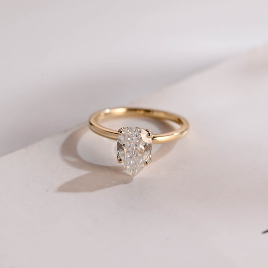 Pear cut moissanite diamond ring