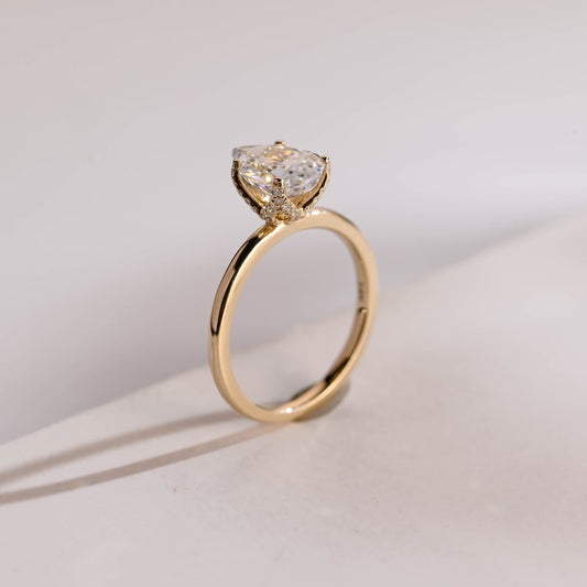 Pear cut moissanite diamond ring