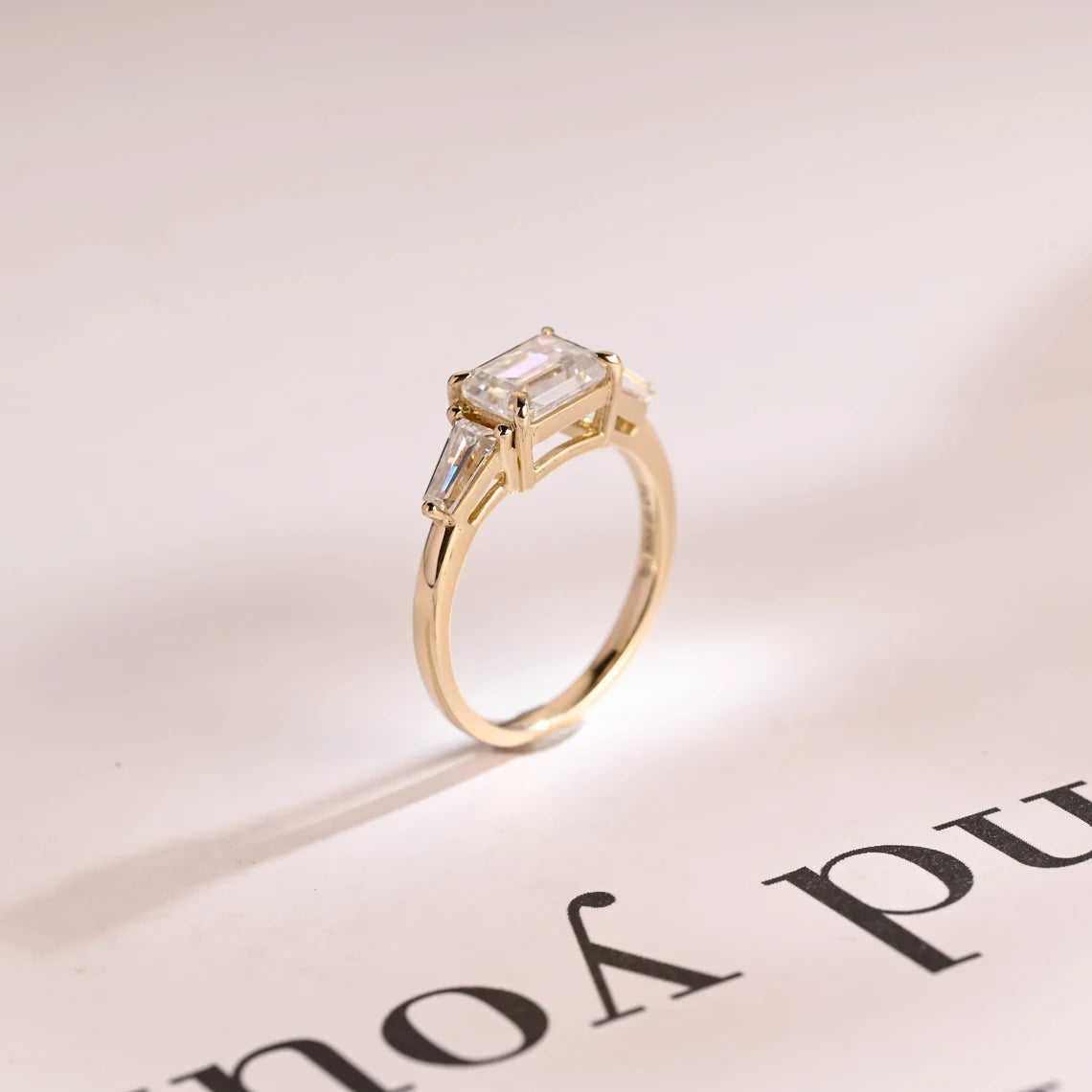 Tapered baguette side stone ring