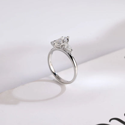 Pear cut side stone ring