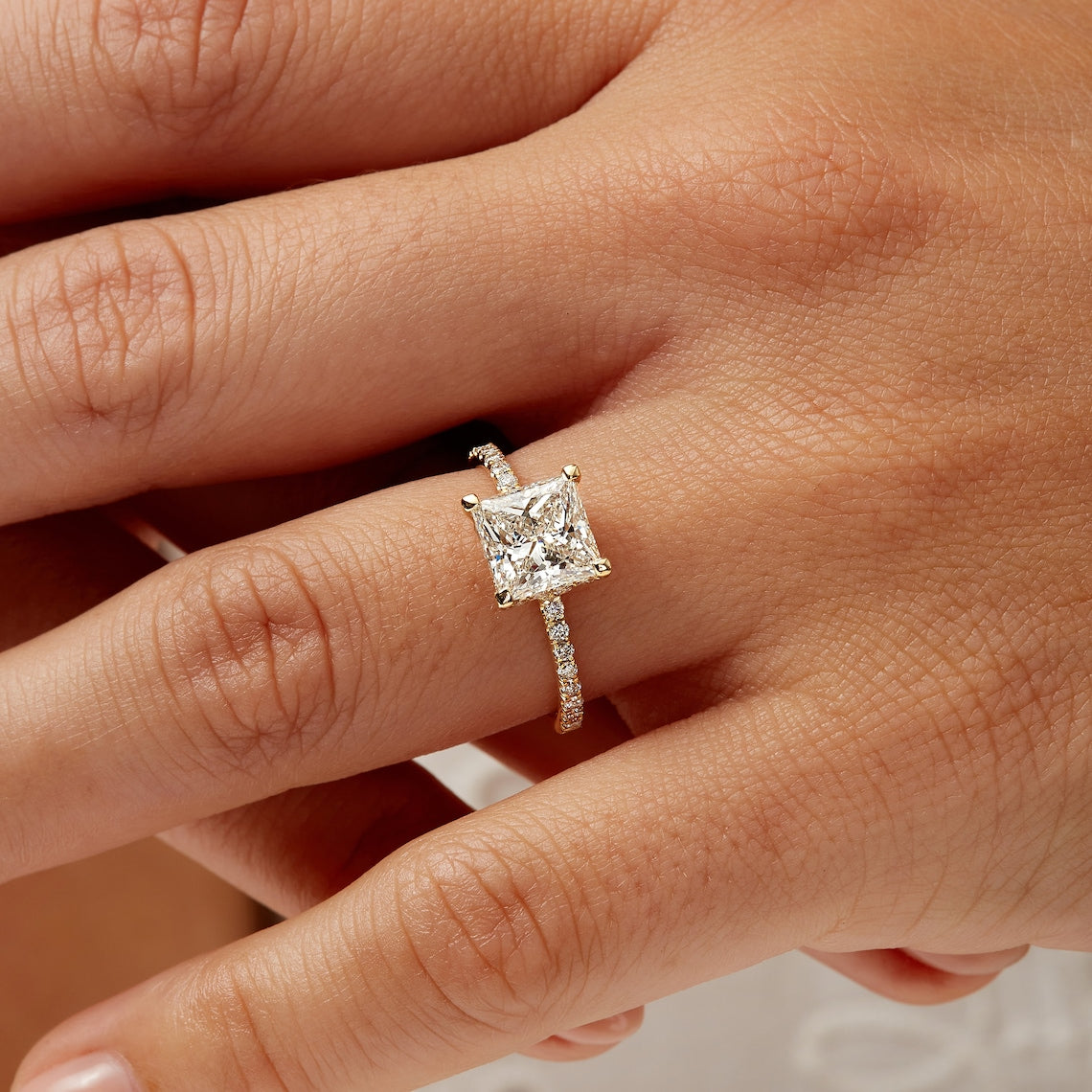 Classic hidden halo diamond ring