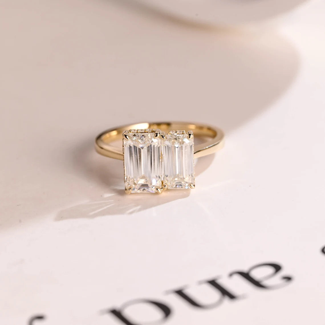 Emerald cut two stone ring