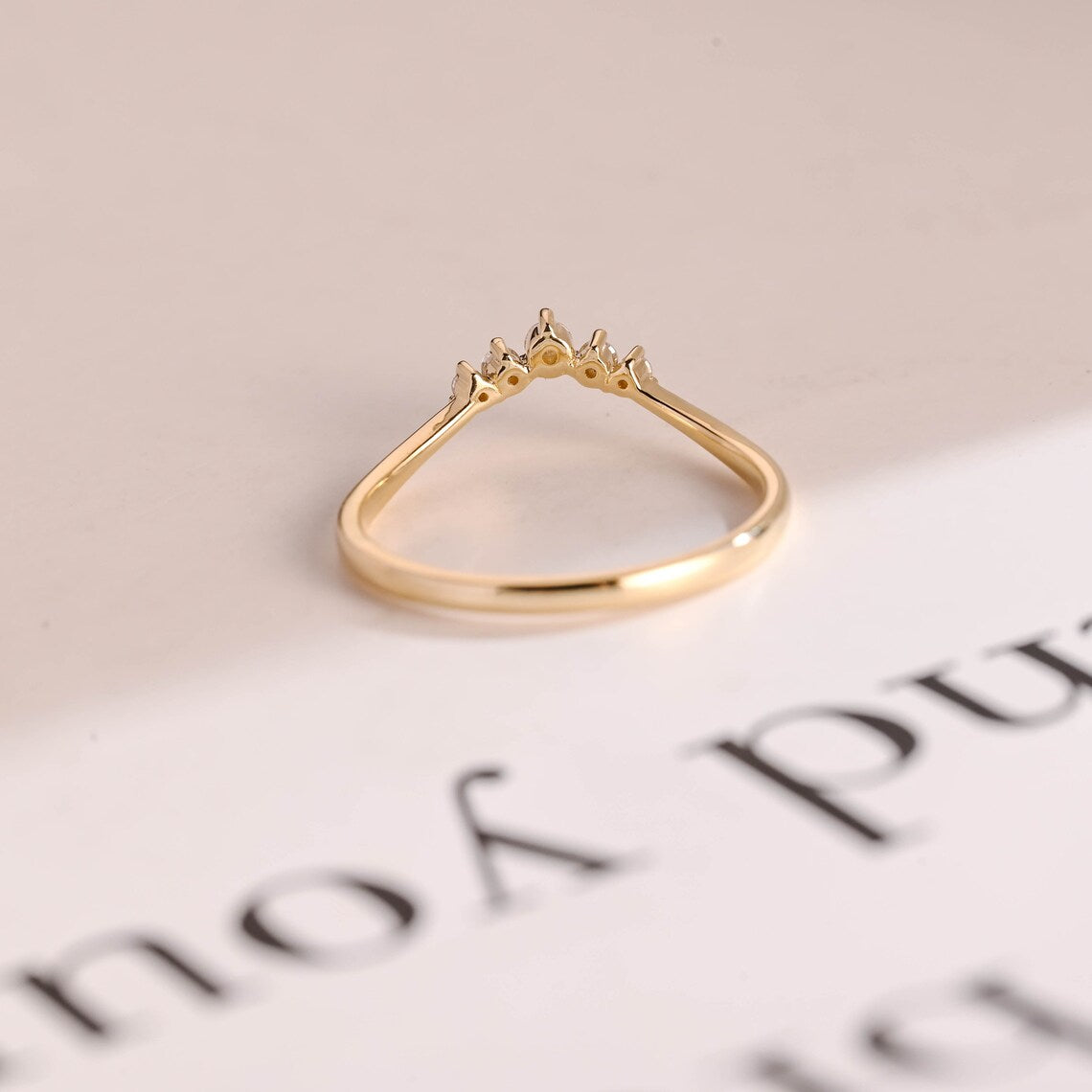 Gold curved wedding band