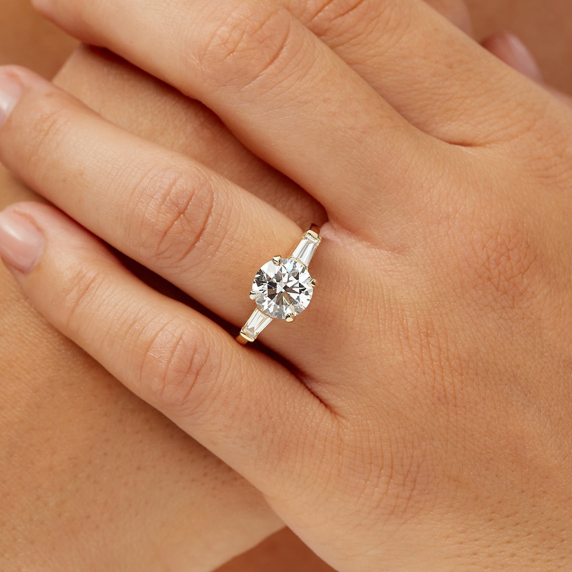 Tapered baguette side stone ring