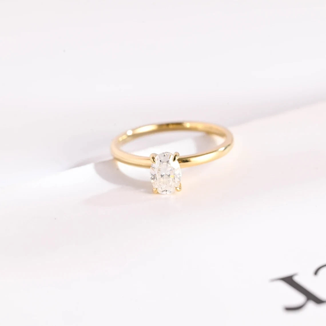 Oval Moissanite solitaire ring with hidden halo diamond accents. brilliance, timeless design and perfect for engagements or special gifts.