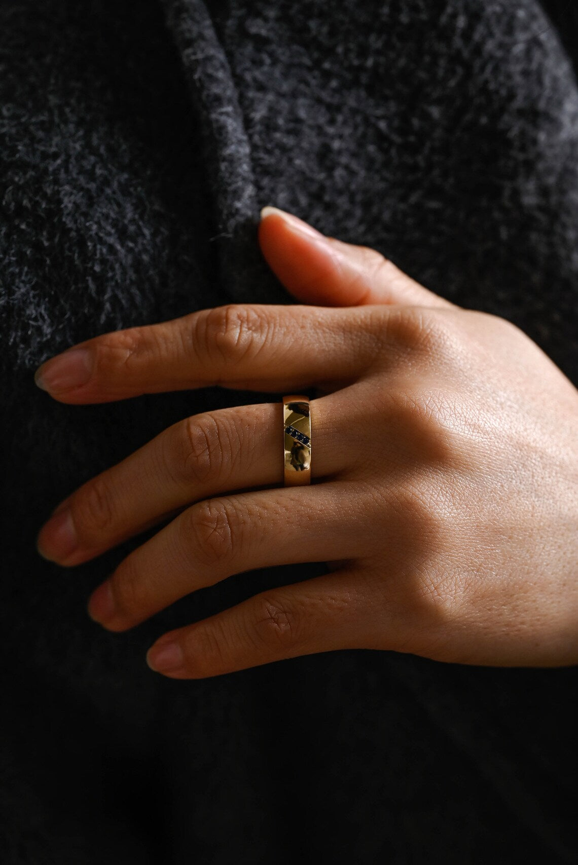 Discover a refined solid gold band accented with round cut royal blue sapphires. unisex ring ideal for weddings, anniversaries, or everyday luxury style.