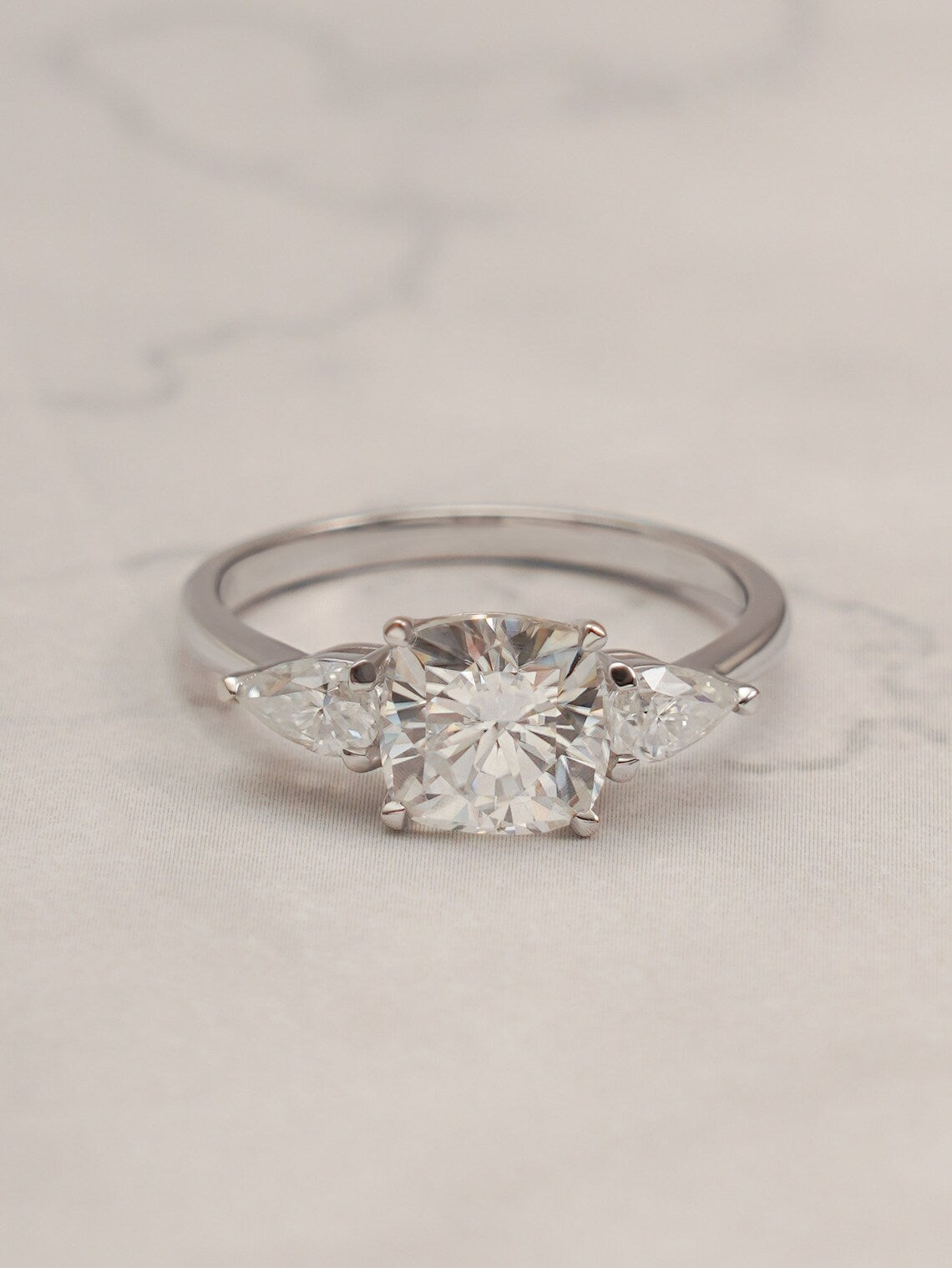 Three stone engagement ring