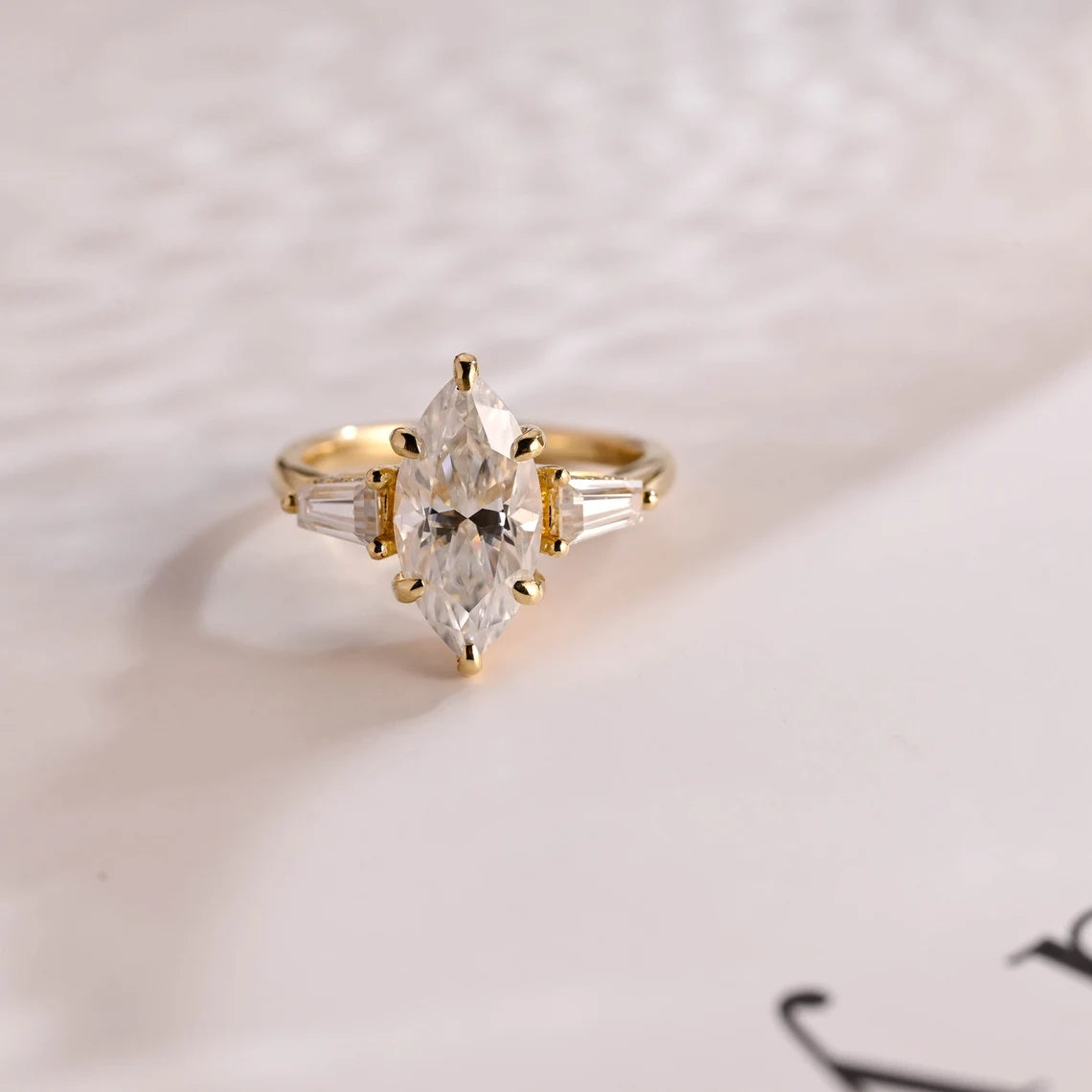 Three stone engagement ring