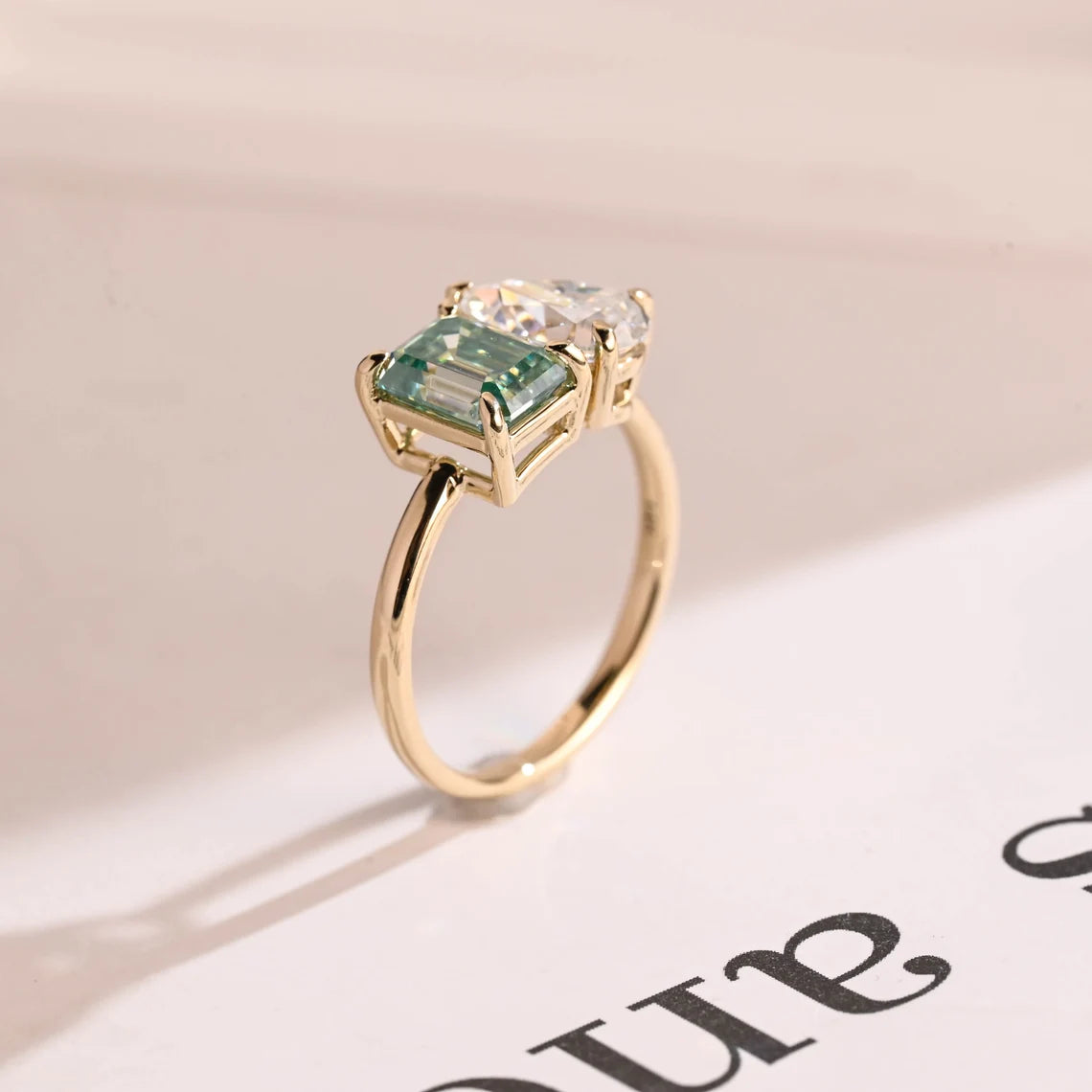 Light green emerald cut moissanite ring
