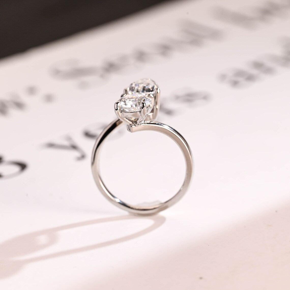 Pear cut moissanite diamond ring