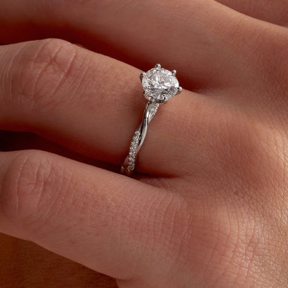 Twisted crossover-shank pave ring
