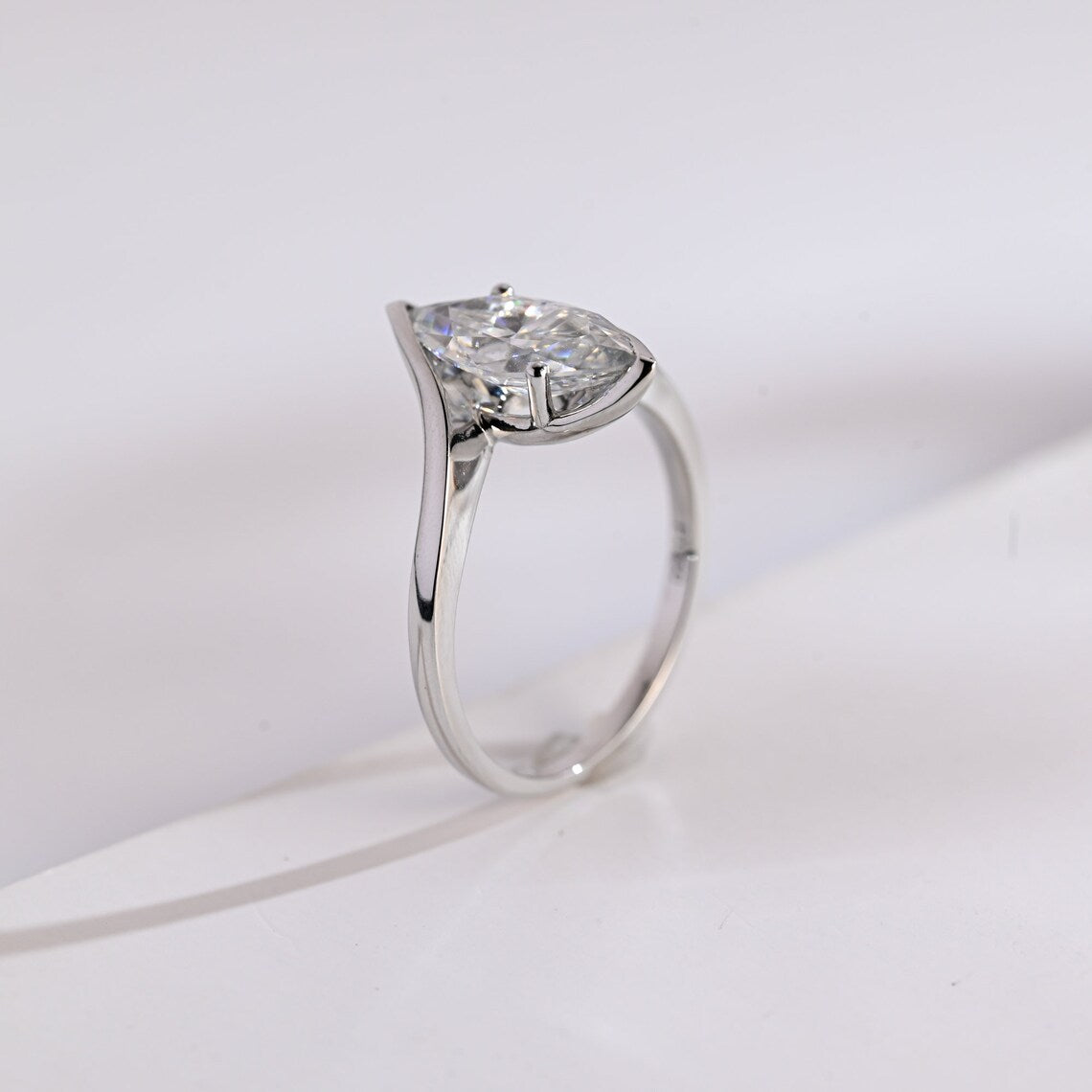 Tension-set engagement ring