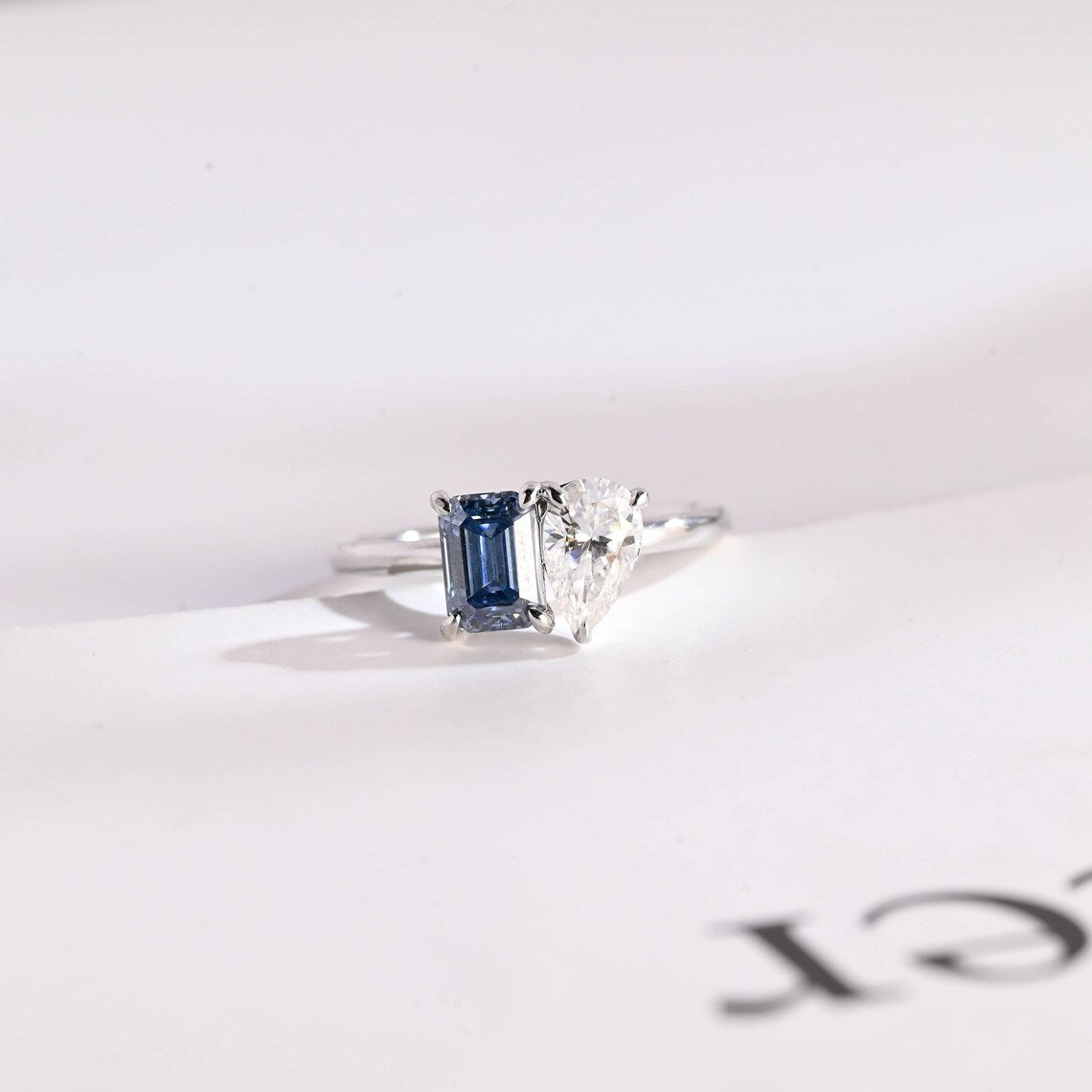 Blue emerald cut moissanite ring