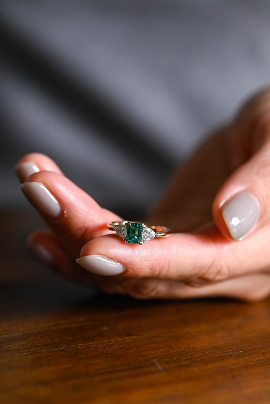 Green emerald cut moissanite ring