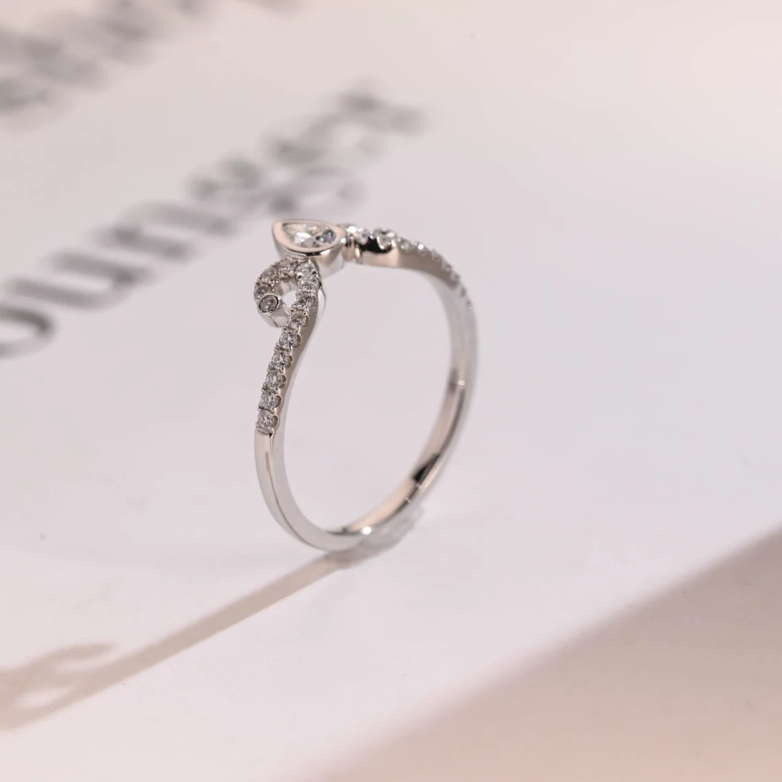 Pear diamond curved band