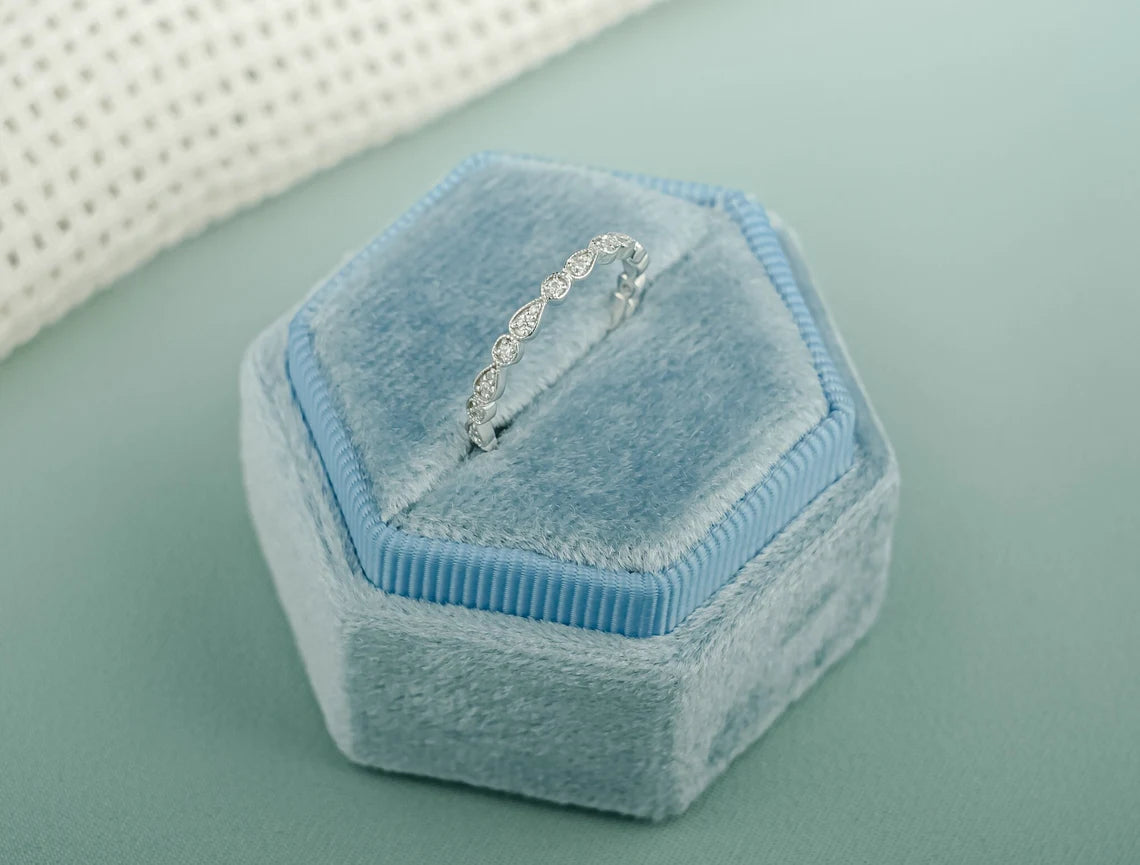 Pear & round cut moissanite ring