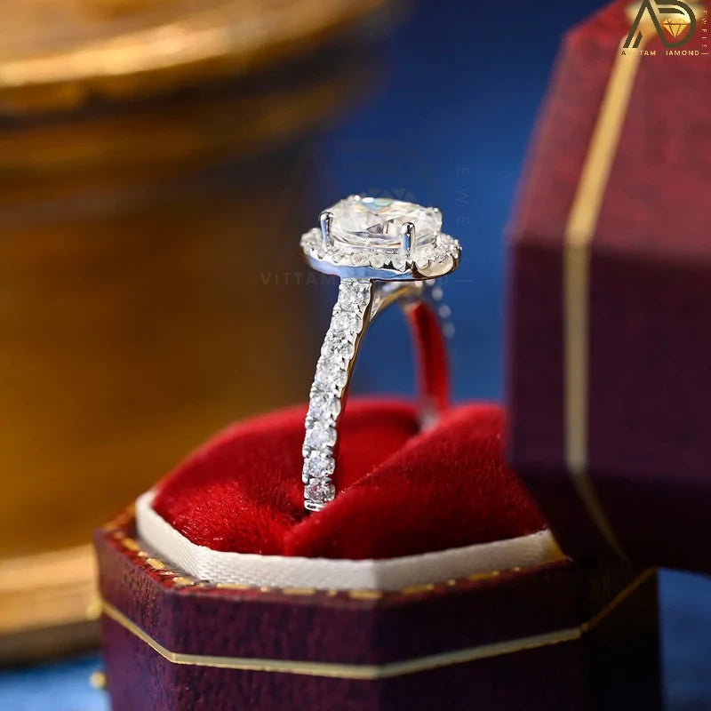 Discover our stunning 1.0 CT oval cut moissanite ring featuring a beautiful halo design and pave setting. The perfect anniversary gift for your loved one!