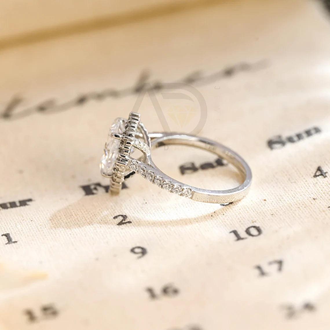 halo pear ring, pear engagement ring, pear halo ring, halo diamond ring, halo moissanite ring, pear cut ring, pear diamond ring, pear moissanite ring, halo bridal ring, pear wedding ring, halo promise ring, vintage pear ring, elegant pear ring, unique pear ring, classic pear ring, custom pear ring, gold pear ring, platinum pear ring, silver pear ring, pear eternity ring, pear three stone ring, halo anniversary ring, luxury pear ring, dainty pear ring, simple pear ring