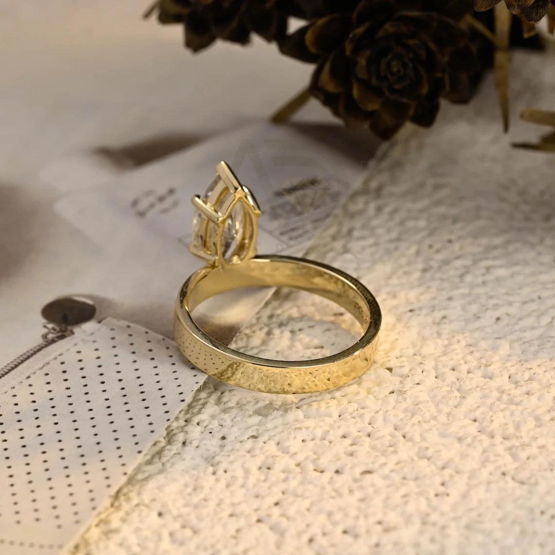 marquise cut ring, moissanite wedding ring, marquise engagement ring, wedding band, bridal jewelry, unique ring, vintage style, halo ring, diamond alternative, anniversary gift, gold band, silver band, platinum band, handcrafted ring, dainty jewelry, elegant design, timeless beauty, luxury ring, custom made, fine jewelry