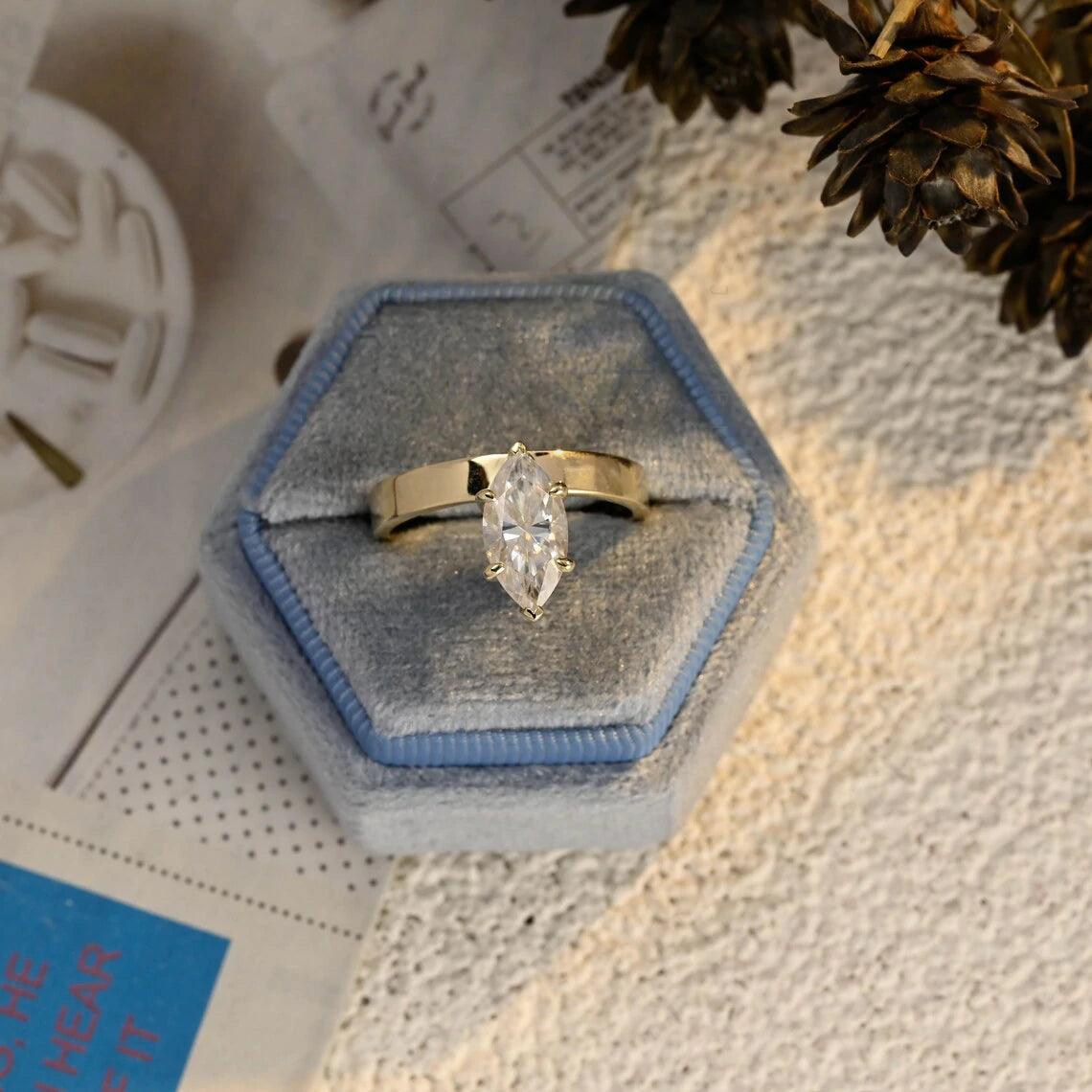 marquise cut ring, moissanite wedding ring, marquise engagement ring, wedding band, bridal jewelry, unique ring, vintage style, halo ring, diamond alternative, anniversary gift, gold band, silver band, platinum band, handcrafted ring, dainty jewelry, elegant design, timeless beauty, luxury ring, custom made, fine jewelry