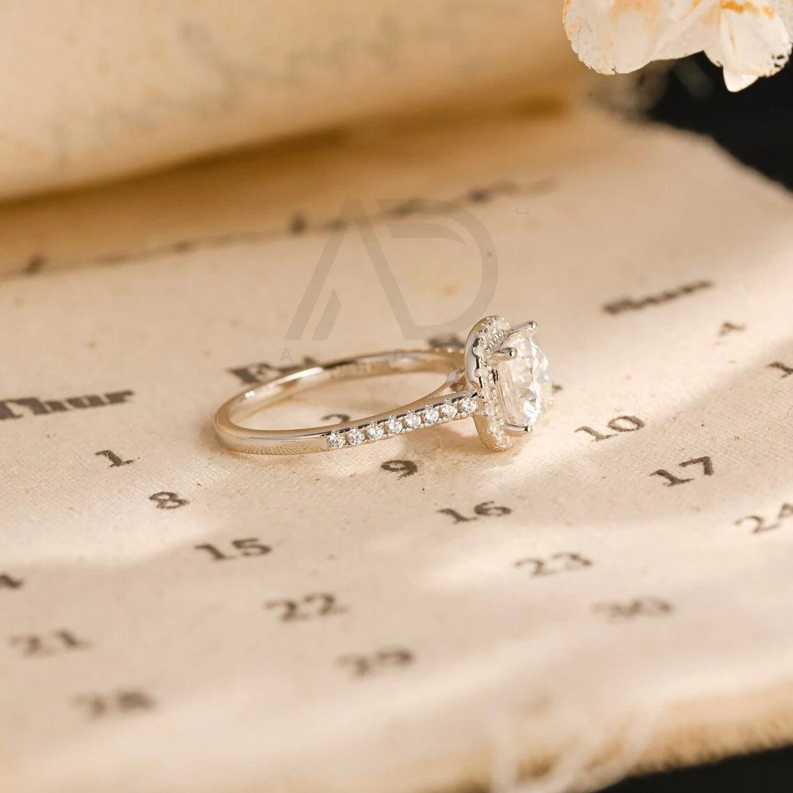 moissanite engagement, cushion diamond ring, halo diamond ring, cushion bridal ring, moissanite bridal ring, cushion wedding ring, halo wedding ring, cushion halo ring, moissanite cushion cut, elegant cushion ring, unique halo ring, vintage halo ring, classic cushion ring, custom cushion ring, gold cushion ring, platinum cushion ring, silver cushion ring, luxury cushion ring, simple cushion ring, anniversary cushion ring