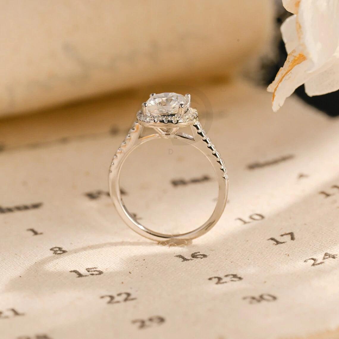 moissanite engagement, cushion diamond ring, halo diamond ring, cushion bridal ring, moissanite bridal ring, cushion wedding ring, halo wedding ring, cushion halo ring, moissanite cushion cut, elegant cushion ring, unique halo ring, vintage halo ring, classic cushion ring, custom cushion ring, gold cushion ring, platinum cushion ring, silver cushion ring, luxury cushion ring, simple cushion ring, anniversary cushion ring