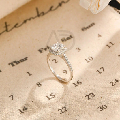 moissanite engagement, cushion diamond ring, halo diamond ring, cushion bridal ring, moissanite bridal ring, cushion wedding ring, halo wedding ring, cushion halo ring, moissanite cushion cut, elegant cushion ring, unique halo ring, vintage halo ring, classic cushion ring, custom cushion ring, gold cushion ring, platinum cushion ring, silver cushion ring, luxury cushion ring, simple cushion ring, anniversary cushion ring