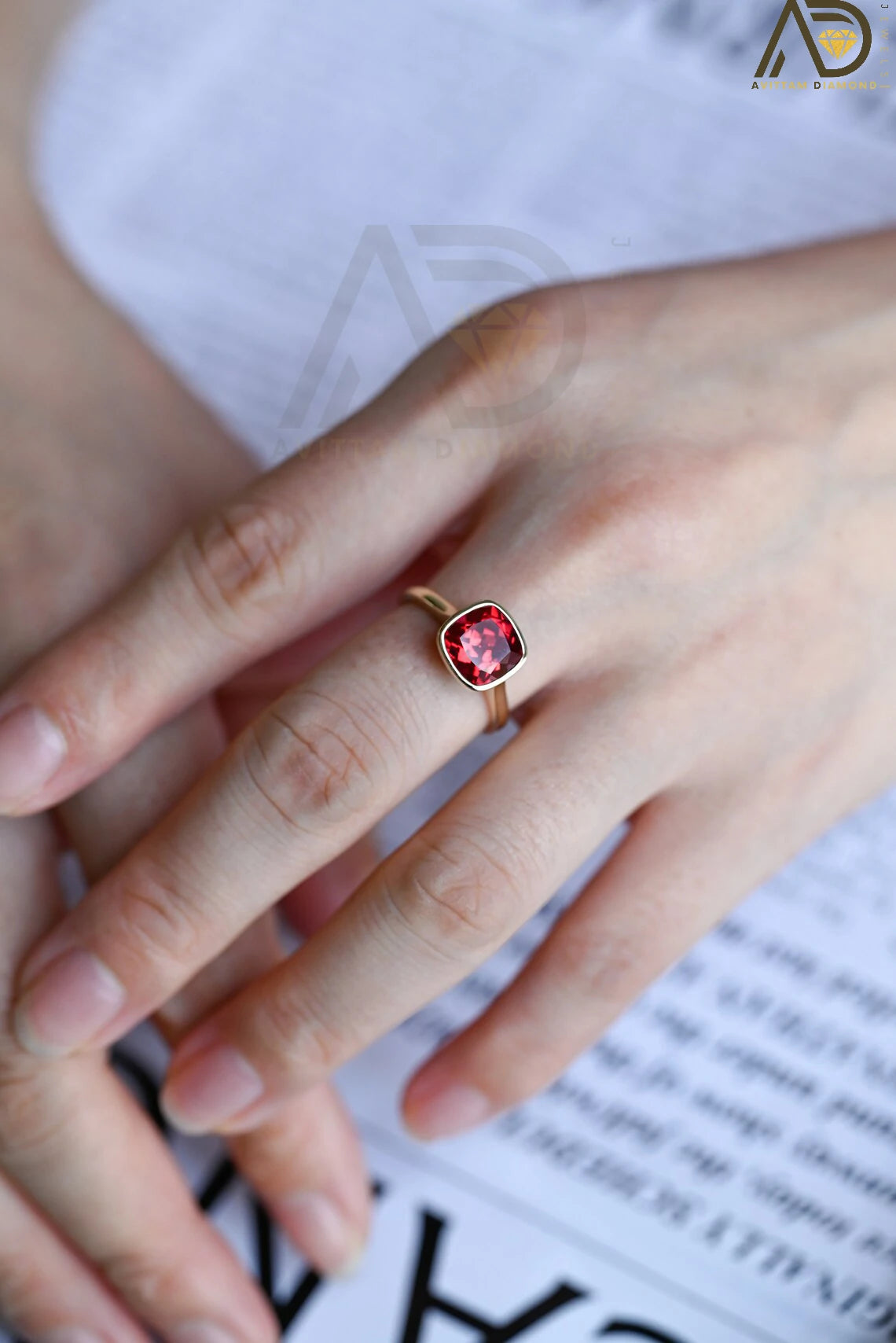 Celebrate love with our stunning Solid Gold Cushion Cut Ruby Engagement Ring. With its timeless bezel design, this classic vintage ring makes an ideal gift for anniversaries, promises, or as a July birthstone keepsake.


