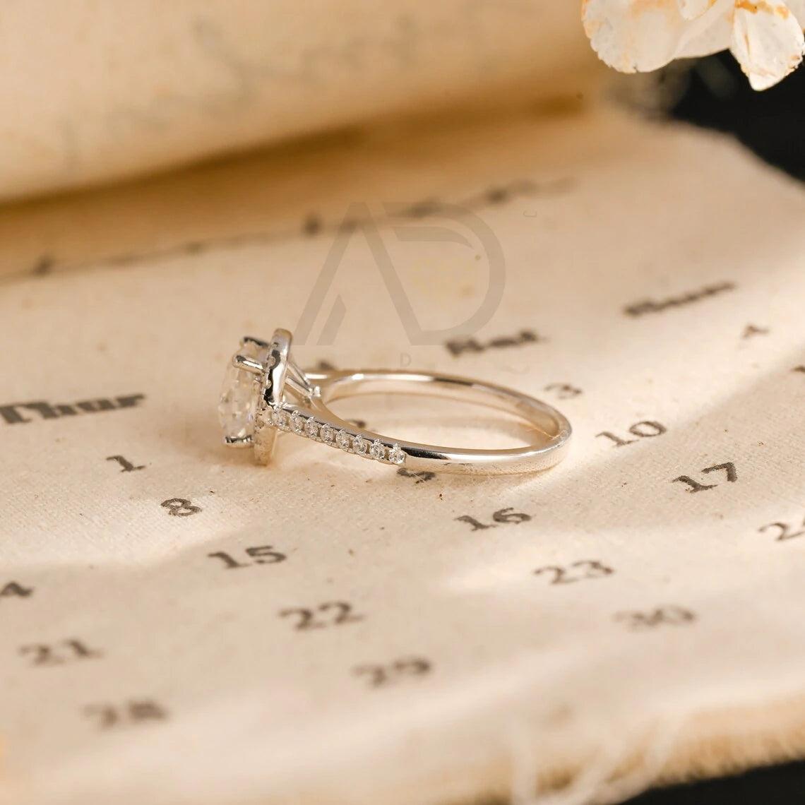 moissanite engagement, cushion diamond ring, halo diamond ring, cushion bridal ring, moissanite bridal ring, cushion wedding ring, halo wedding ring, cushion halo ring, moissanite cushion cut, elegant cushion ring, unique halo ring, vintage halo ring, classic cushion ring, custom cushion ring, gold cushion ring, platinum cushion ring, silver cushion ring, luxury cushion ring, simple cushion ring, anniversary cushion ring