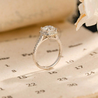 moissanite engagement, cushion diamond ring, halo diamond ring, cushion bridal ring, moissanite bridal ring, cushion wedding ring, halo wedding ring, cushion halo ring, moissanite cushion cut, elegant cushion ring, unique halo ring, vintage halo ring, classic cushion ring, custom cushion ring, gold cushion ring, platinum cushion ring, silver cushion ring, luxury cushion ring, simple cushion ring, anniversary cushion ring