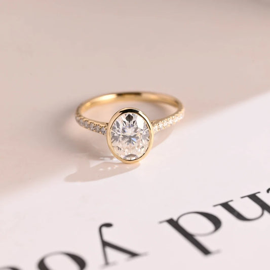 oval moissanite ring | bezel engagement ring | yellow gold bridal
