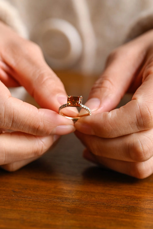 Champagne east west emerald cut ring