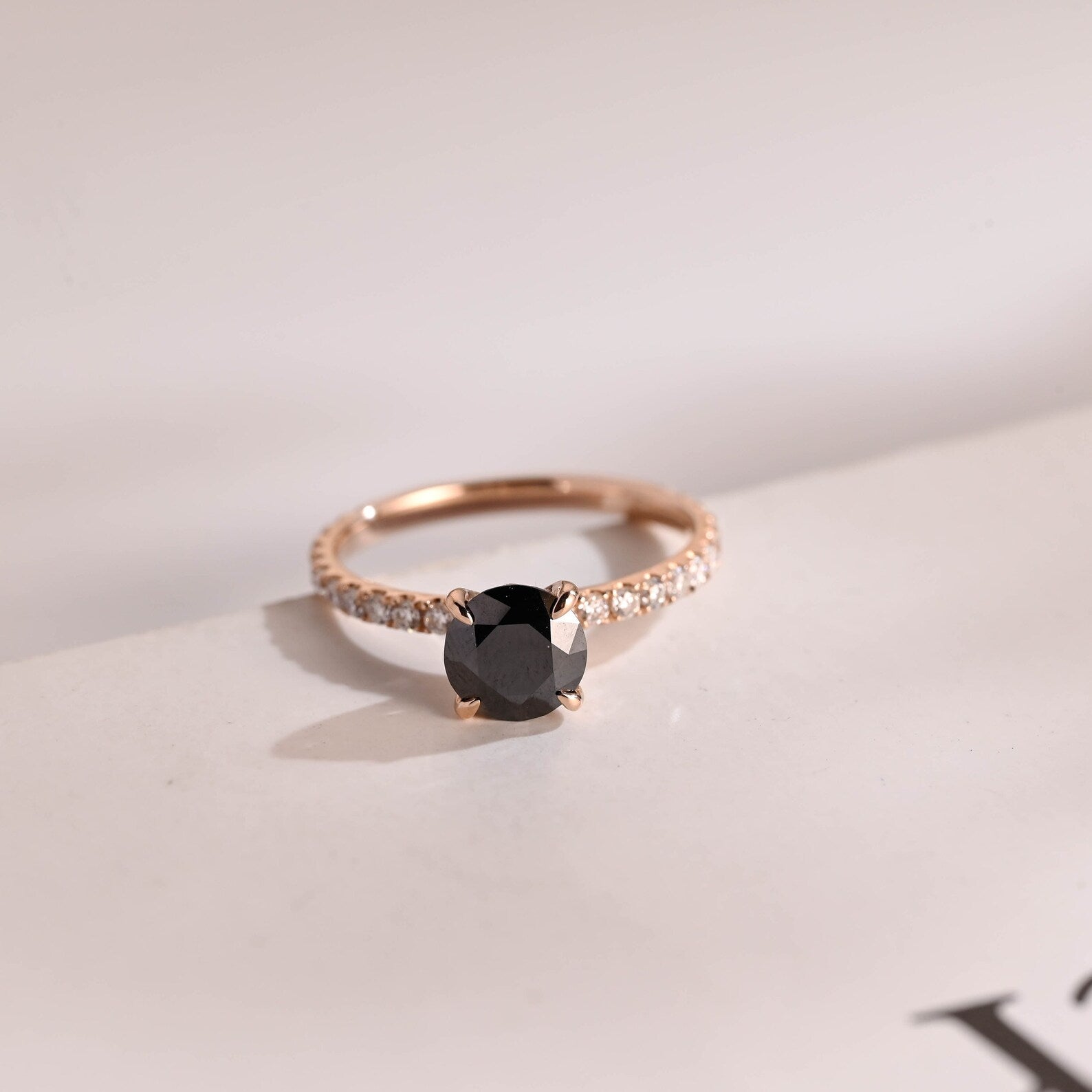 Black round cut moissanite ring
