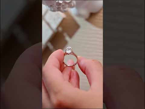 Bezel Marquise cut moissanite solitaire ring with cathedral shank design. Handcrafted in solid gold for timeless engagement elegance and everyday luxury.