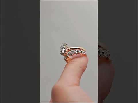 Oval cut moissanite cluster halo engagement ring set with a half eternity pave timeless bridal design crafted for sparkle, elegance, and everyday beauty.