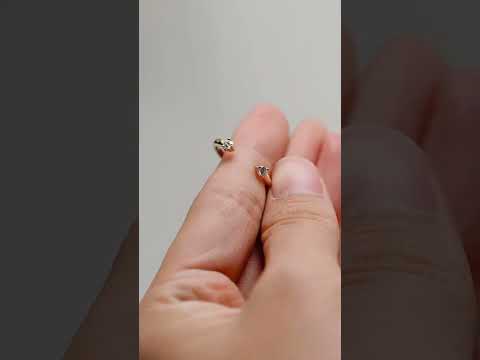 Minimalist open band ring with round cut moissanite diamonds in solid gold. A modern wedding band or stacking ring with timeless elegance.