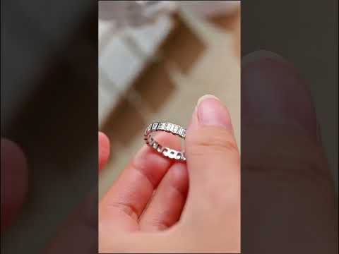 Radiant-cut moissanite eternity band with a modern full bezel setting. A luxurious wedding or anniversary ring offering brilliant sparkle and timeless elegance.