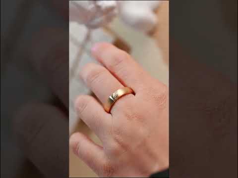 Minimalist brushed gold wedding band with a diamond accent. Solid gold unisex ring, perfect for weddings, anniversaries, or everyday luxury wear.