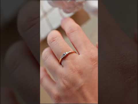 Three-stone Lab Grown ring in solid gold. round cut stones symbolizing past, present, and future love. Perfect for engagements, anniversaries & gifts.
