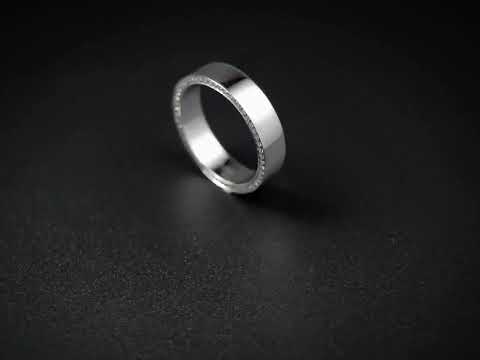 Side round cut moissanite channel-set full eternity band ring solitaire solid gold. A minimalist wedding, anniversary, or stackable fine jewelry band.