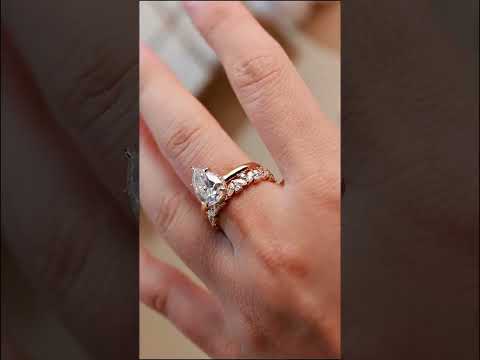 Pear cut moissanite hidden halo engagement ring set with full eternity band yellow gold. timeless perfect for proposals, weddings, or anniversaries.