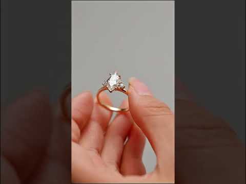Bezel Marquise cut moissanite solitaire ring with cathedral shank design. Handcrafted in solid gold for timeless engagement elegance and everyday luxury.