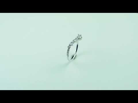 Curved V shape moissanite diamond wedding band with round cut stones. Elegant chevron half eternity ring, perfect for stacking and bridal wear.